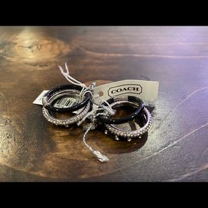 2 sets of 3 Coach rings (valued at $98 each)